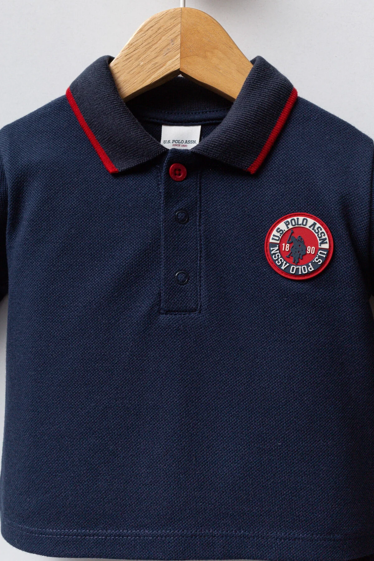 Lacivert U.S. Polo Assn bebek takım elbise, uzun kollu polo ve pantolon, kırmızı detaylı, bebek giyim seti