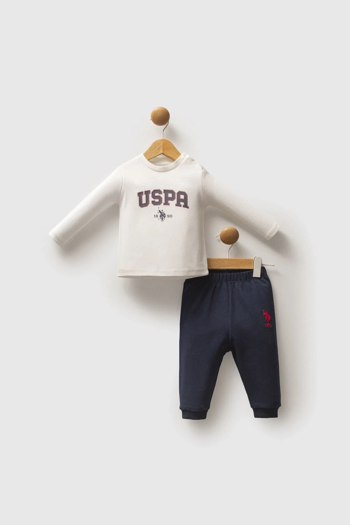 U.S. Polo Assn Erkek Bebek Lacivert Takım, kapüşonlu ceket ve pantolon, kırmızı iç detay, marka logosu, bebek giyim seti