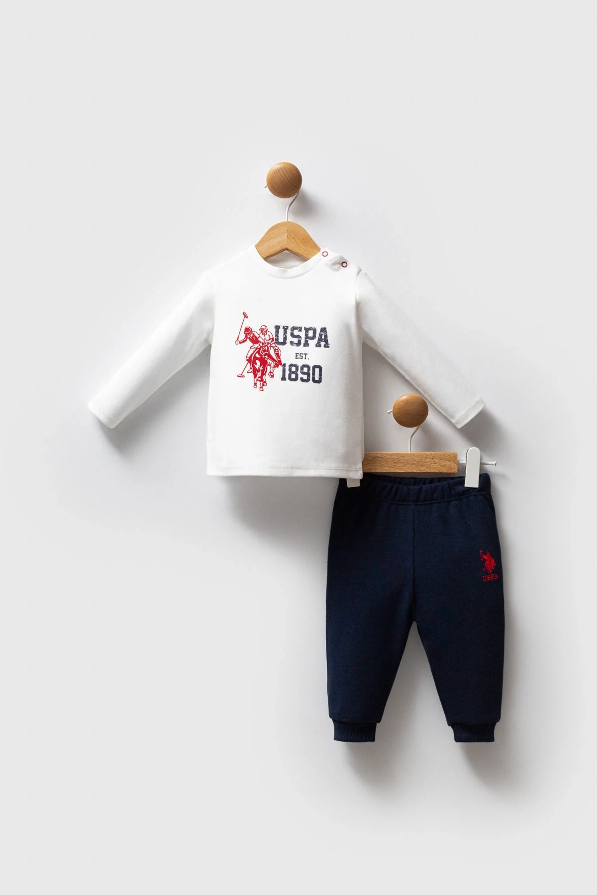 U.S. Polo Assn Erkek Bebek Lacivert Takım, koyu mavi kapüşonlu ceket ve pantolon, kırmızı detaylı, marka logosu, bebek giyim seti