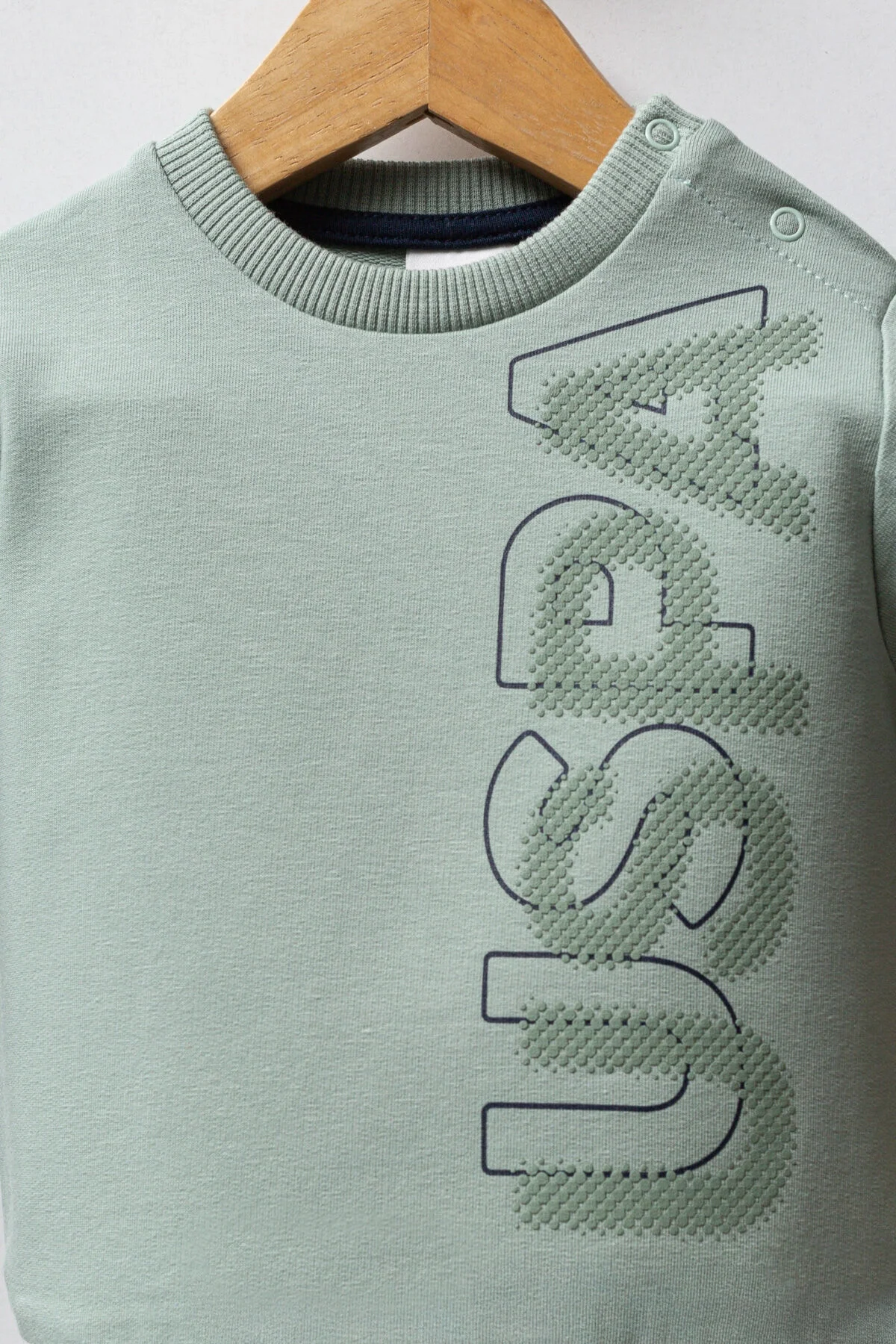 Yeşil USPA yazlık bebek takım elbise, uzun kollu pullover ve mavi pantolon, marka logosuyla bebek giyim seti