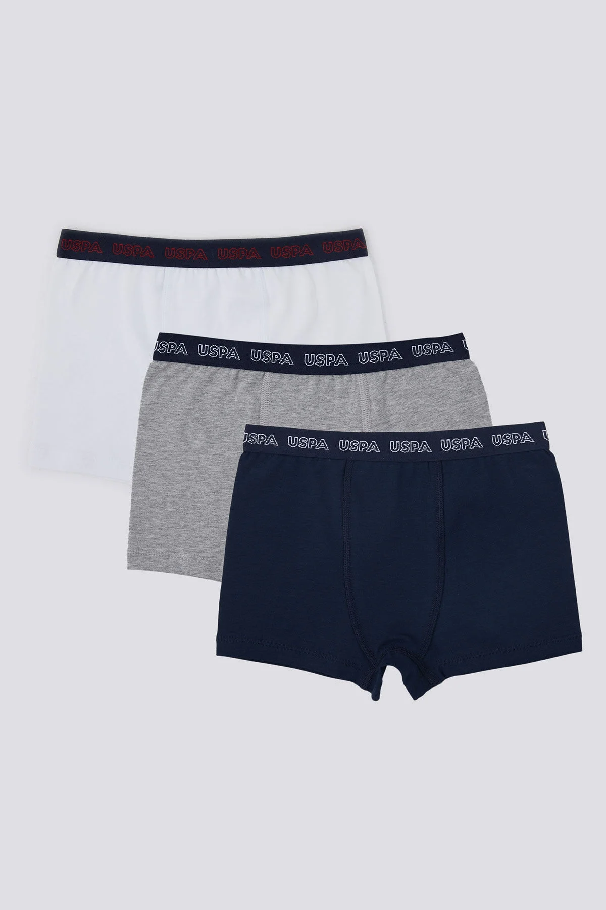 U.S. Polo Assn. Erkek Çocuk Lacivert Boxer 3'lü Set, gri ve beyaz ile birlikte, marka etiketiyle detaylı ürün görseli
