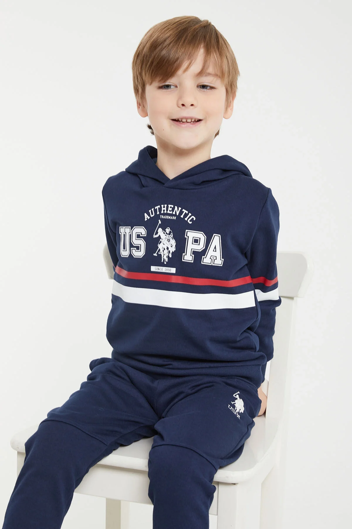 Lacivert US Polo Assn erkek çocuk eşofman takımı, kapüşonlu üst ve pantolon, marka logosu, spor stil, çocuk giyim