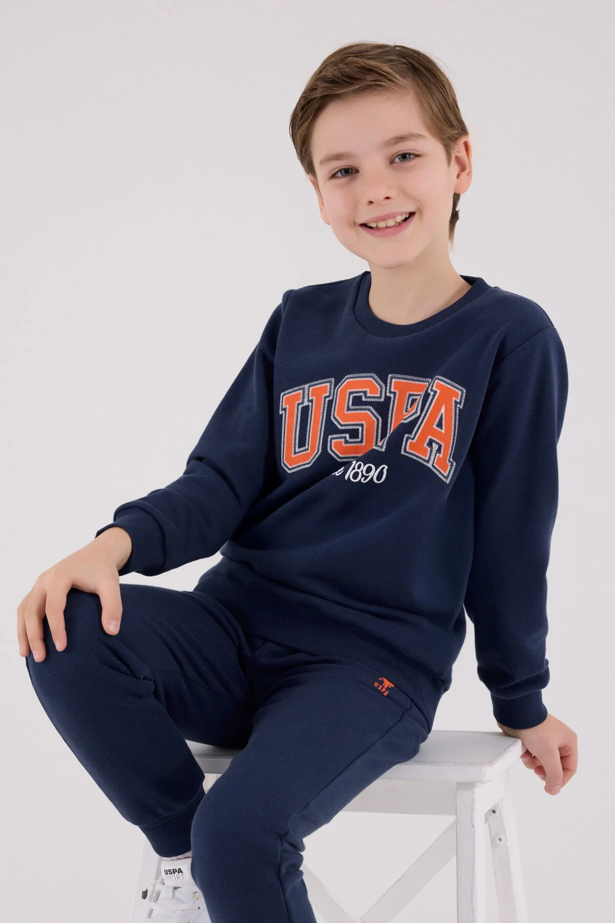 Mavi USPA marka erkek çocuk eşofman takımı, 1990 yazılı ön gömlek ve pantolon, spor stil, çocuk giyim