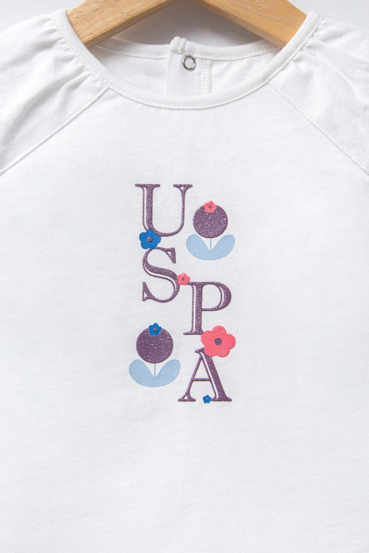 Beyaz U.S. Polo Assn kız bebek takım elbise, mor ve pembe çiçek desenli kısaltılmış etek, bebek giyim seti