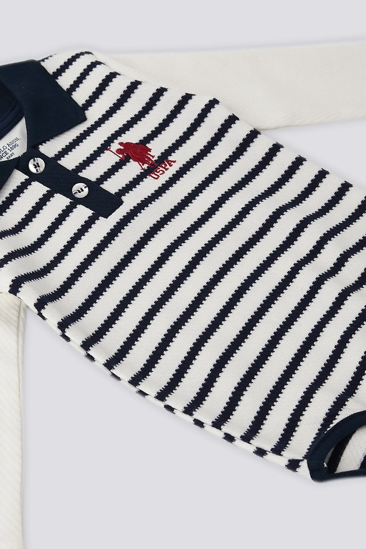 Lacivert ve beyaz çizgili U.S. Polo Assn kız bebek body zıbın, uzun kollu, klasik polo yaka, marka logosu