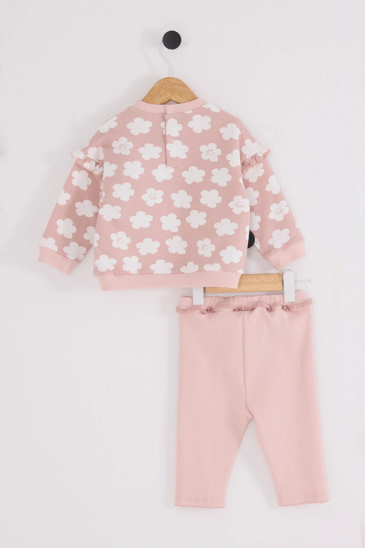 Pembe çiçek desenli U.S. Polo Assn kız bebek takım elbise ve pantolon, ruffle detaylı, marka logosuyla bebek giyim seti