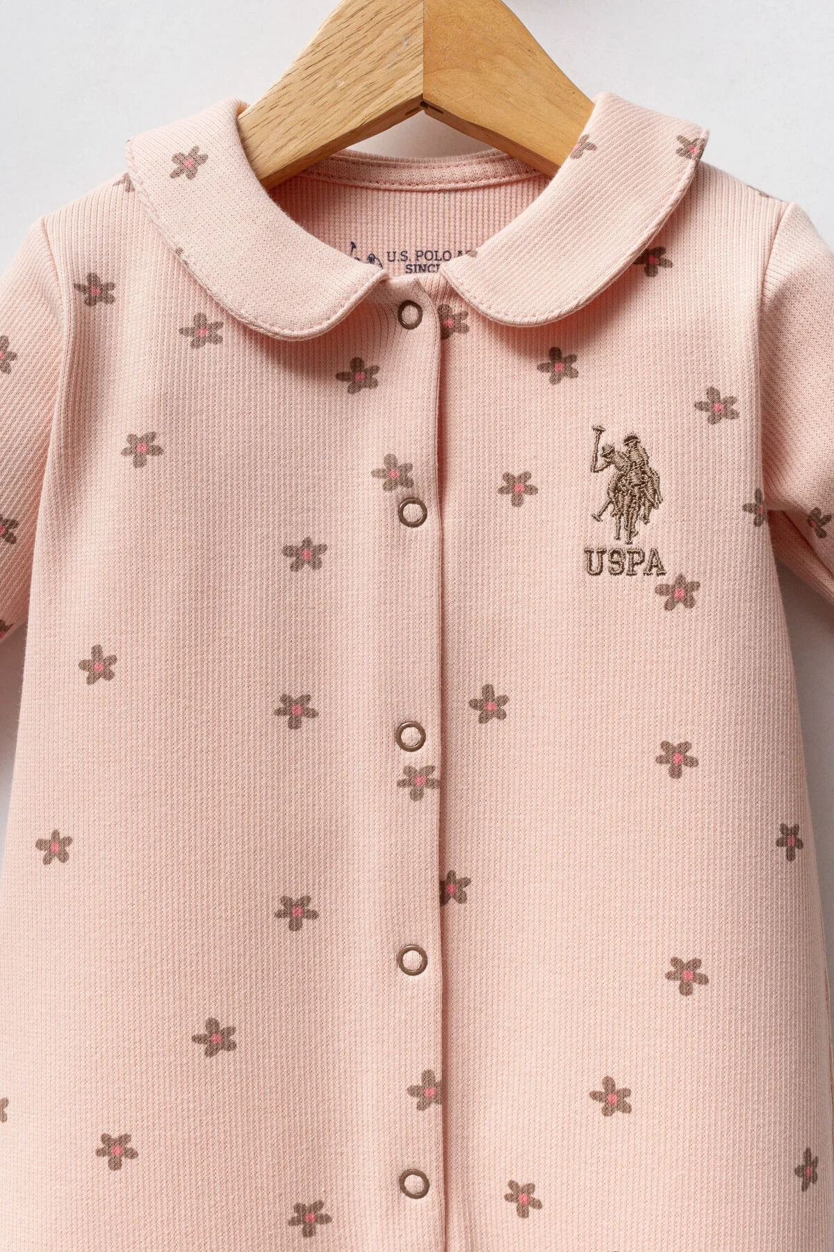 Pembe dantelli U.S. Polo Assn kız bebek tulum, çiçek desenli, ön düğme, ayaklık, bebek giyim ürünü