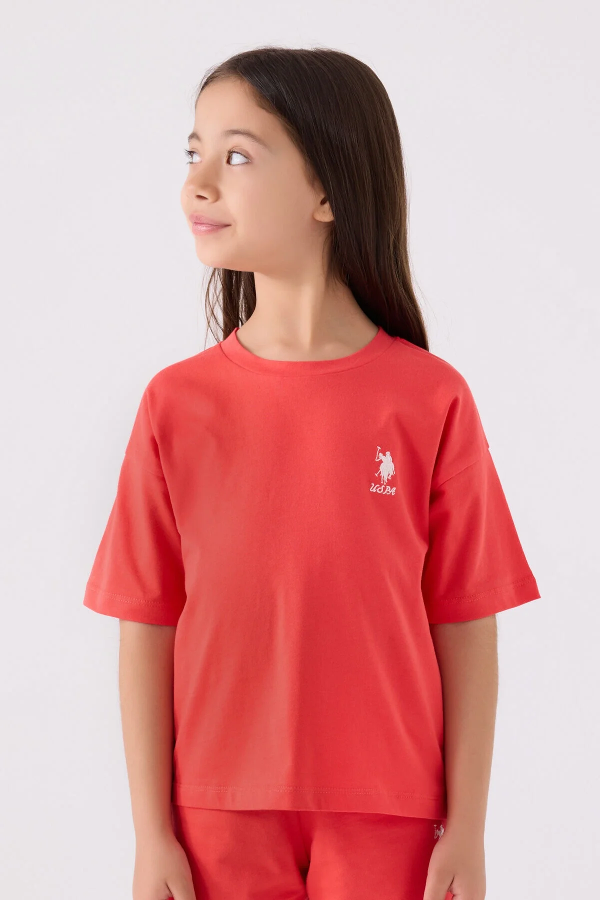 Pembe U.S. Polo Assn kız çocuk Bermuda takım elbette, marka logosu ve spor tarzı detaylarla