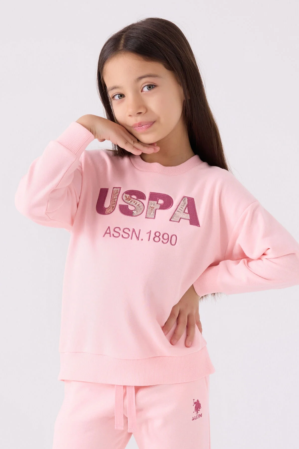 Pembe U.S. Polo Assn kız çocuk eşofman takımı, kıyafet ön görünümü, spor stil, çocuk giyim